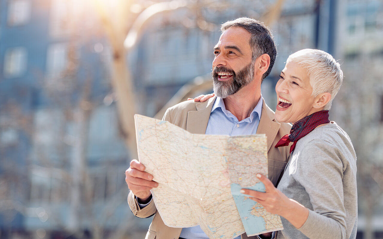 Couple looking at a map while traveling