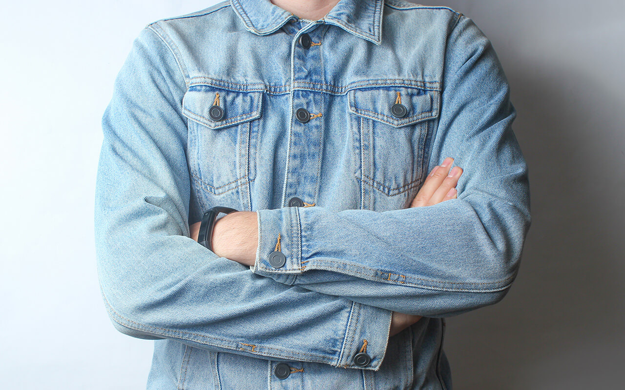 Person wearing a denim jacket