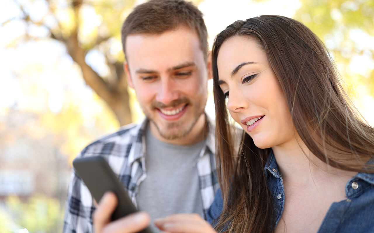 Couple looking at a smartphone