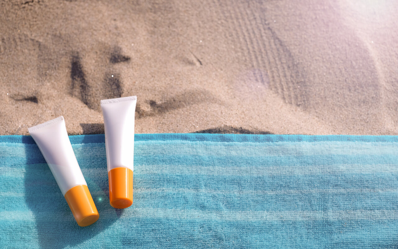 Sunscreen on a beach towel