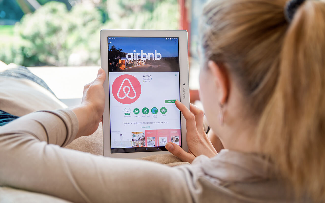 Woman booking an Airbnb