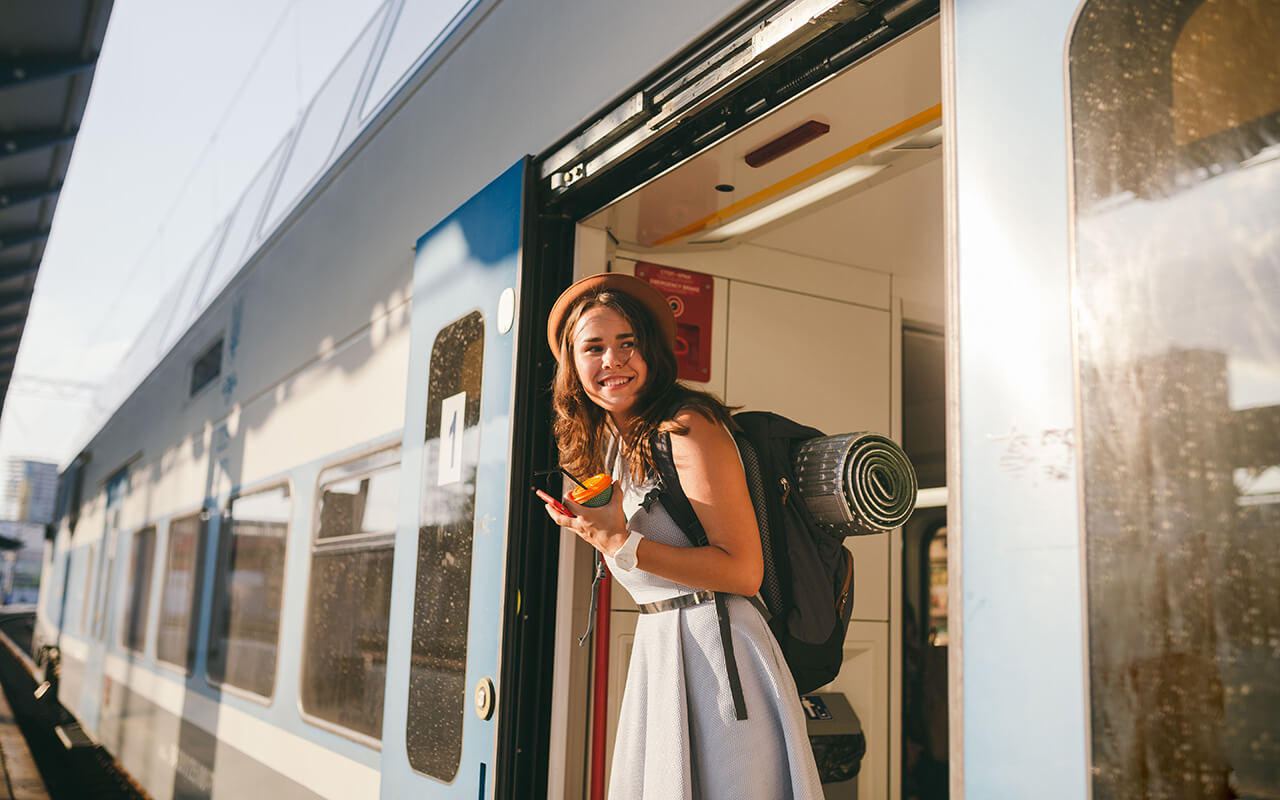 Woman stepping off of a train