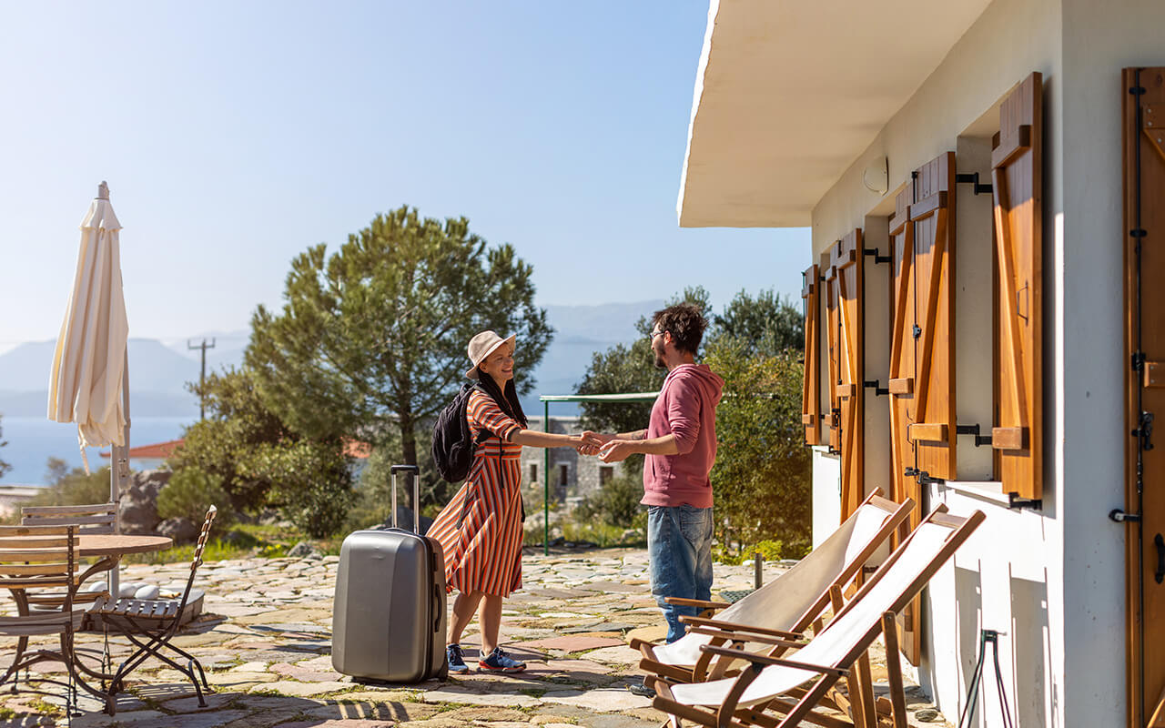 Woman greeting home owner