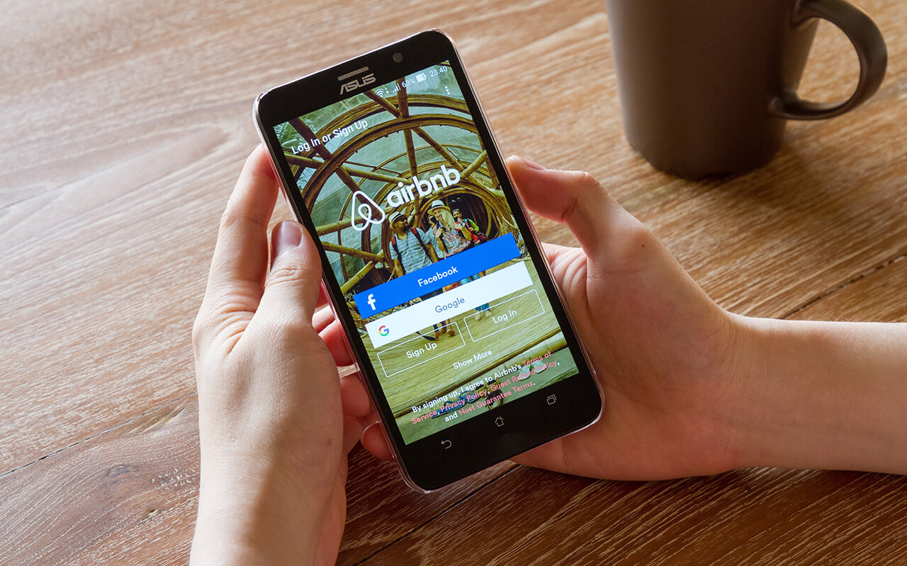 Person using Airbnb app