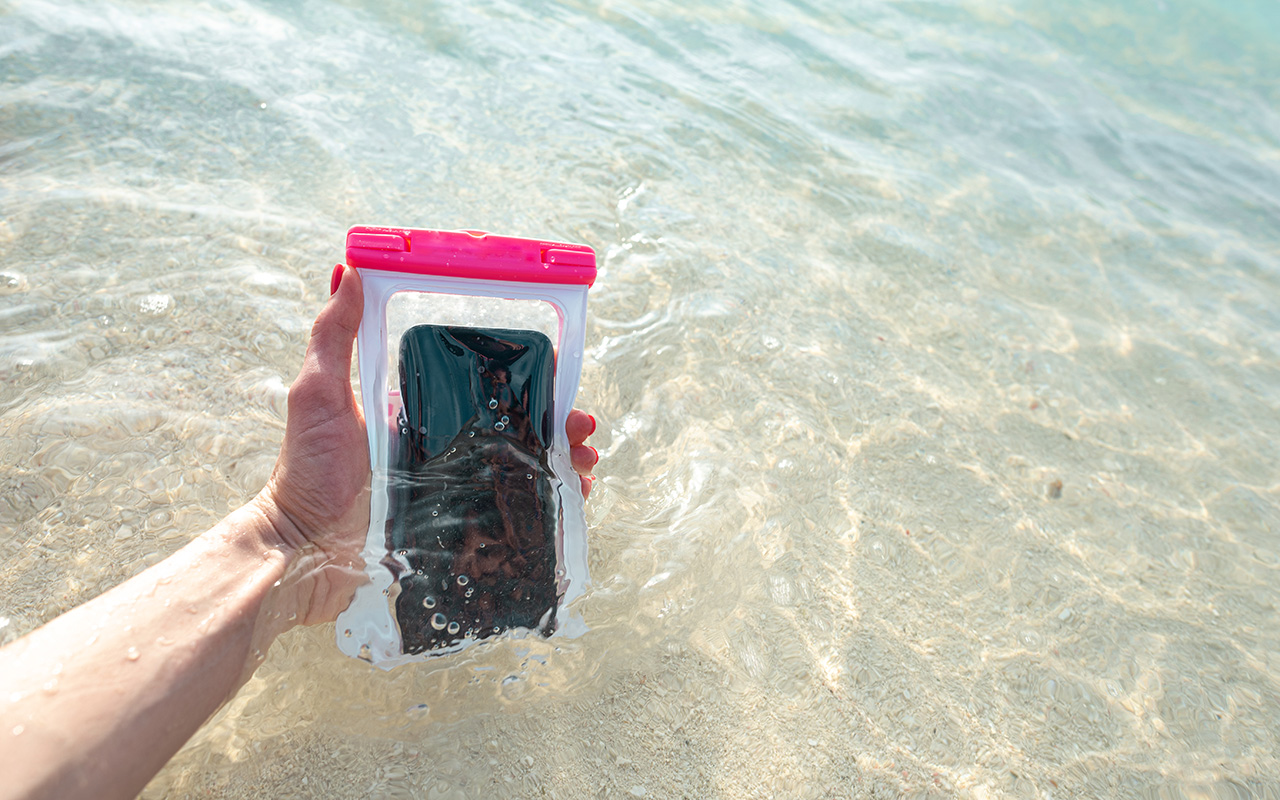 Phone in the ocean in a waterproof case