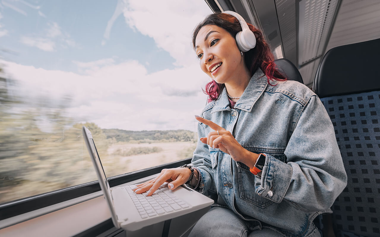 Woman on her computer on a train