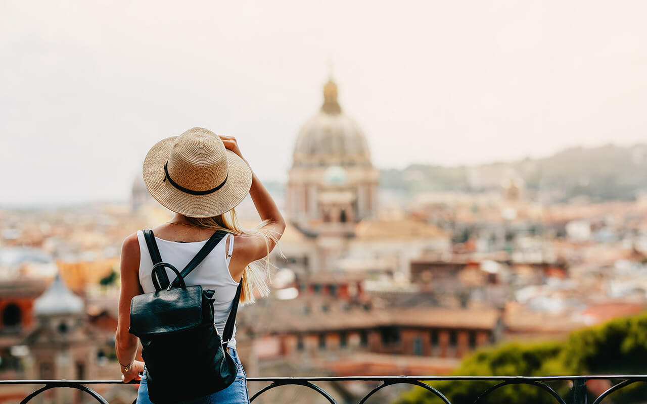 Woman wearing sun hat while traveling