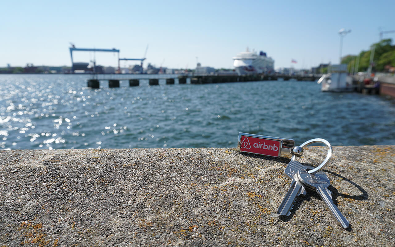 Airbnb keys on a ledge over a river