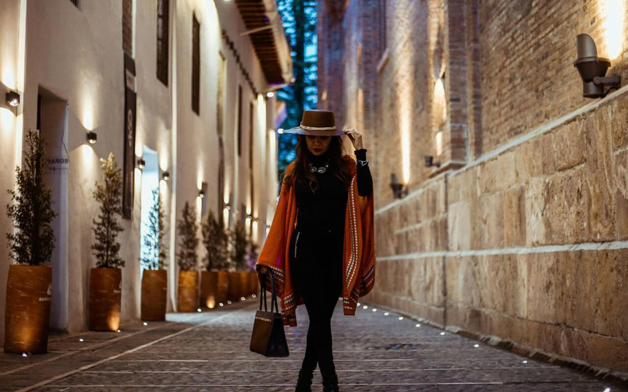 Woman traveling in hat and poncho