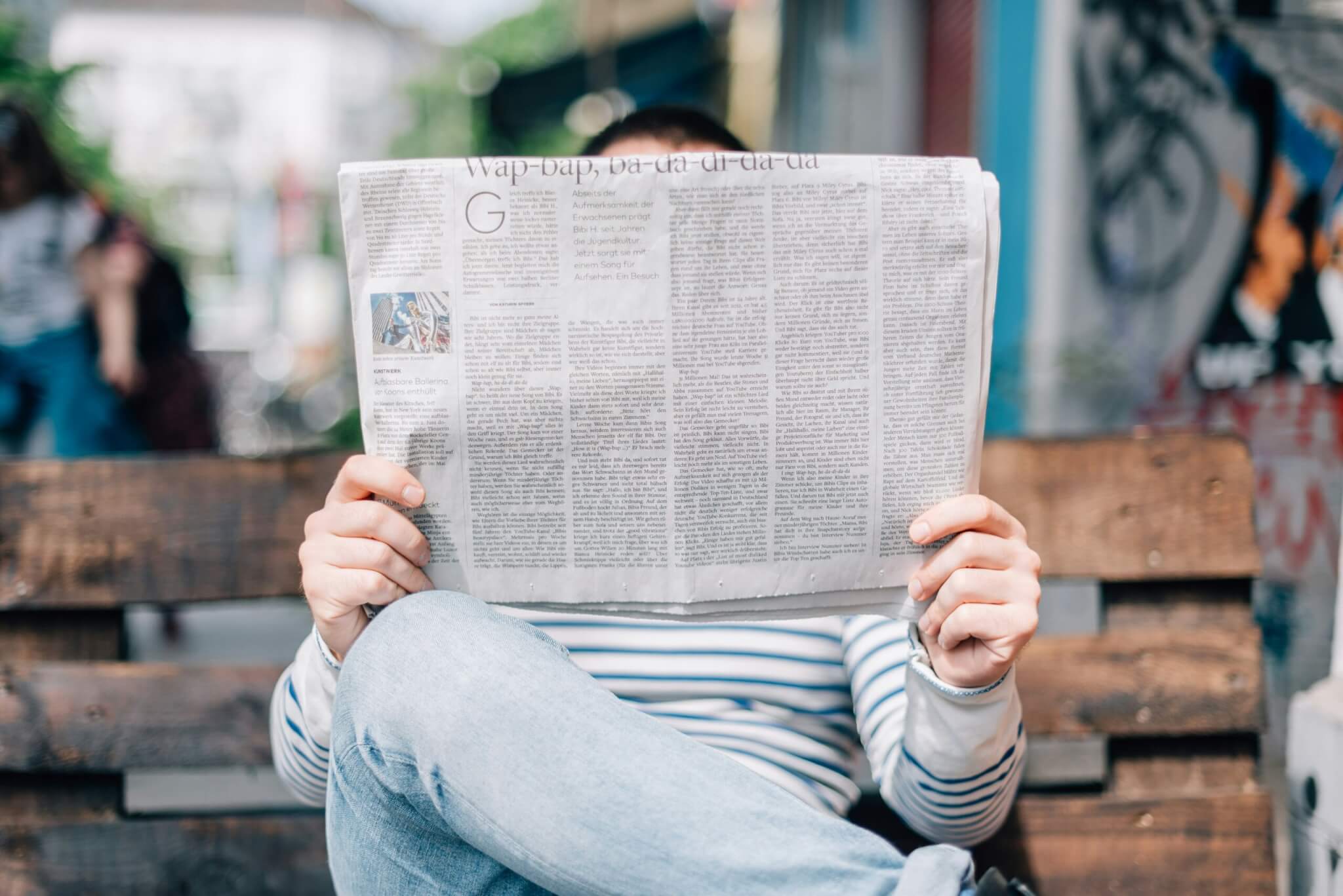 man reading a newspaper