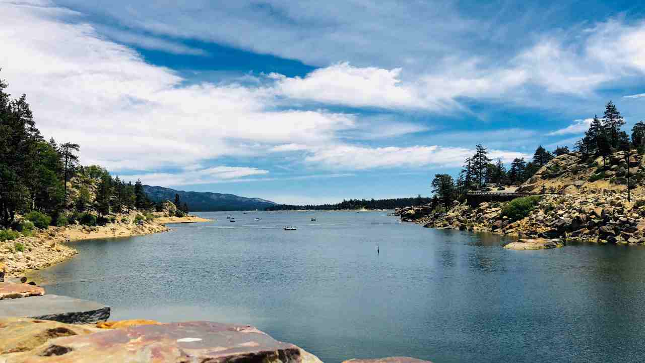 a lake surrounded by trees and rocks