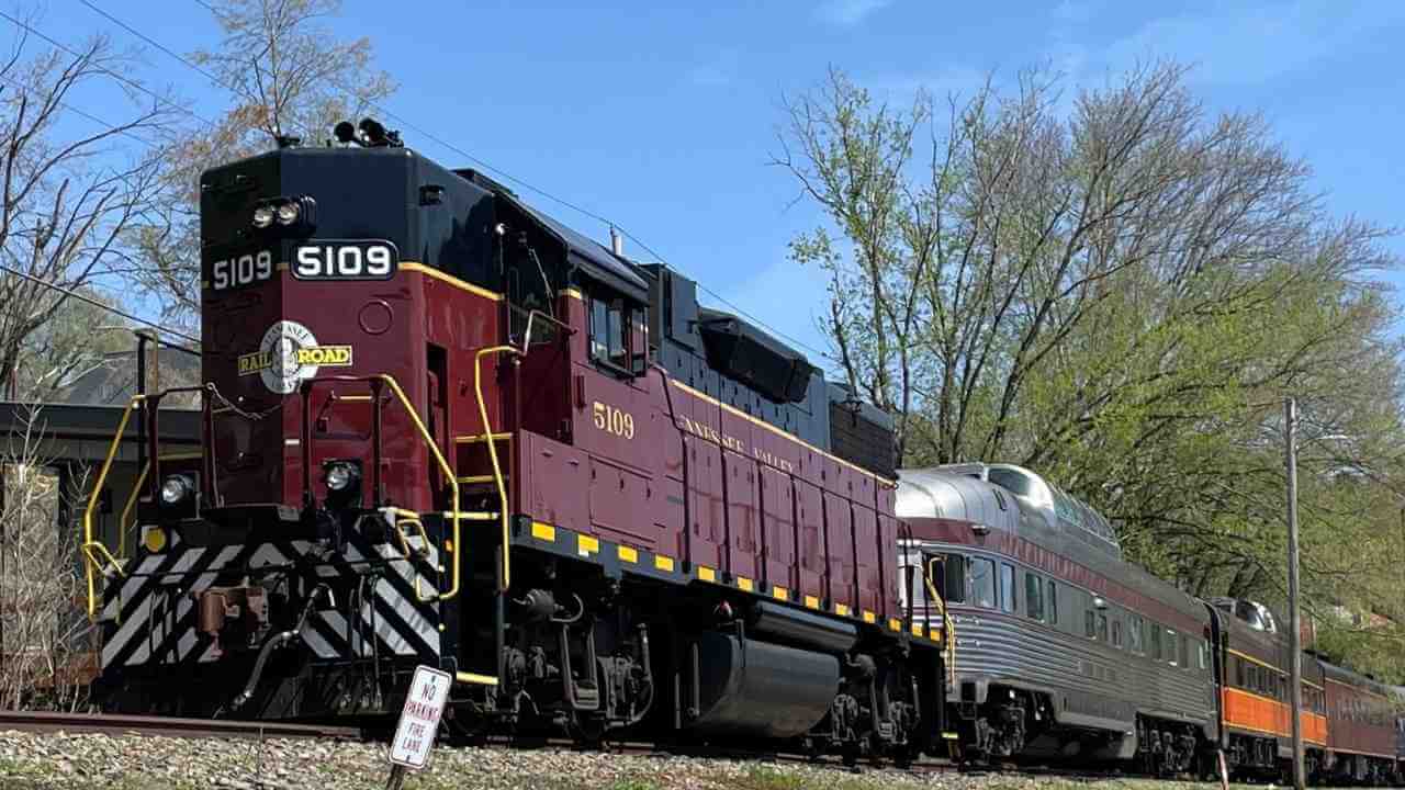 a red and black train engine on the tracks