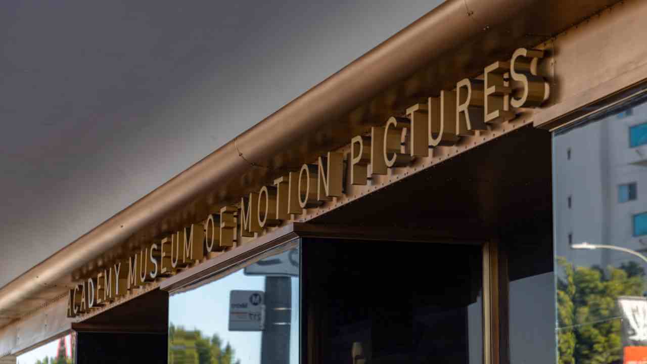 the entrance to a building with a sign on it