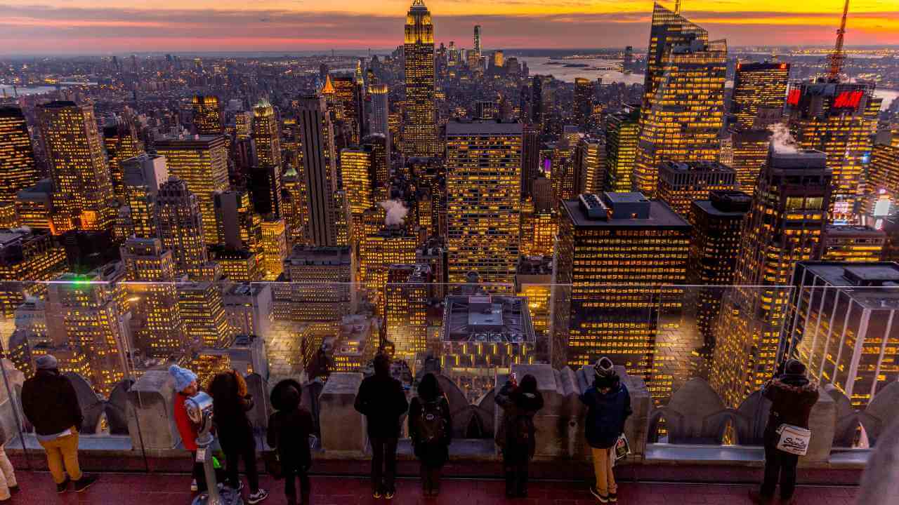 top of the rock observatory deck of the nyc skyline lit up