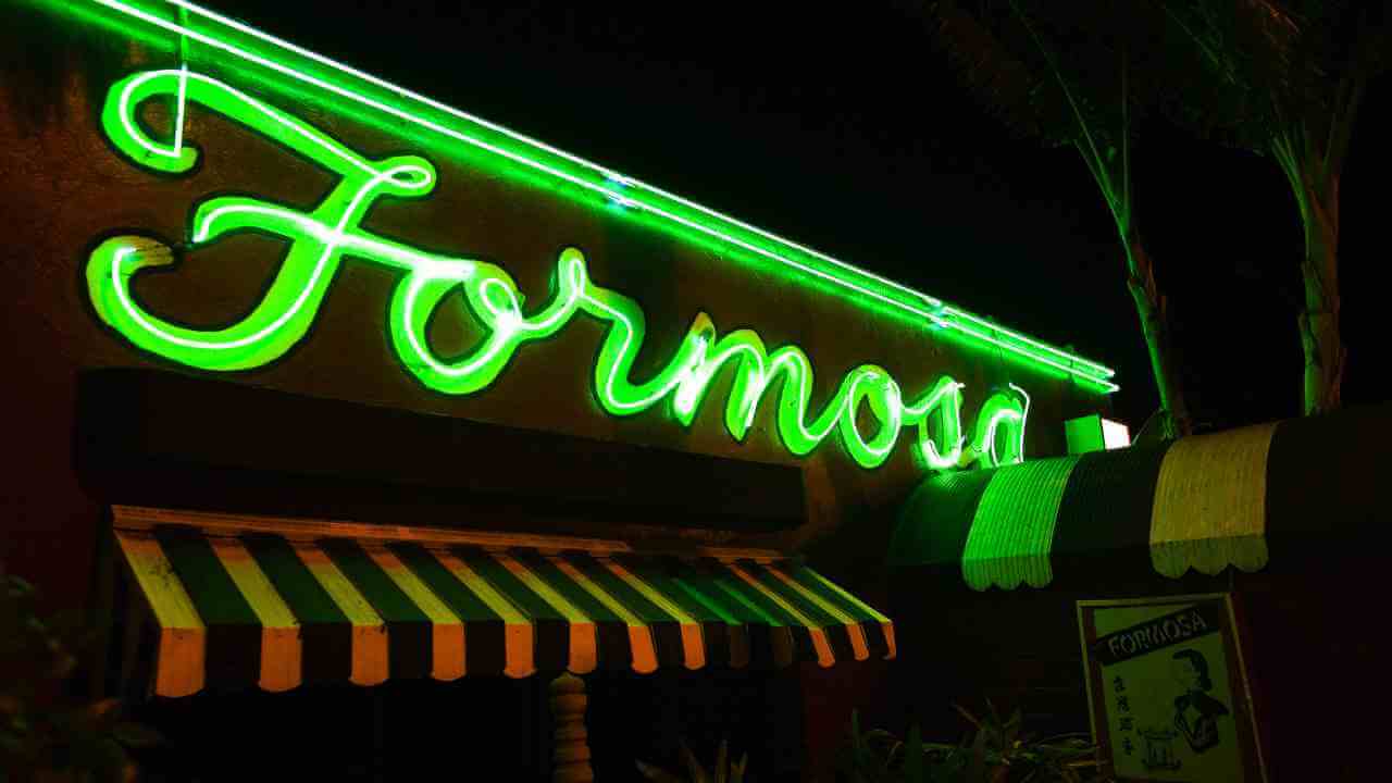 a neon sign with the word formosa lit up at night