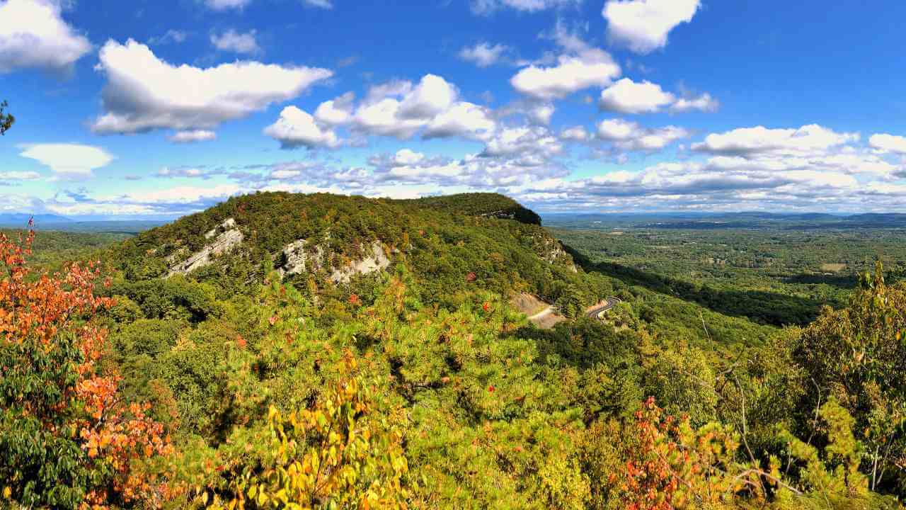 the view from the top of a mountain in the fall