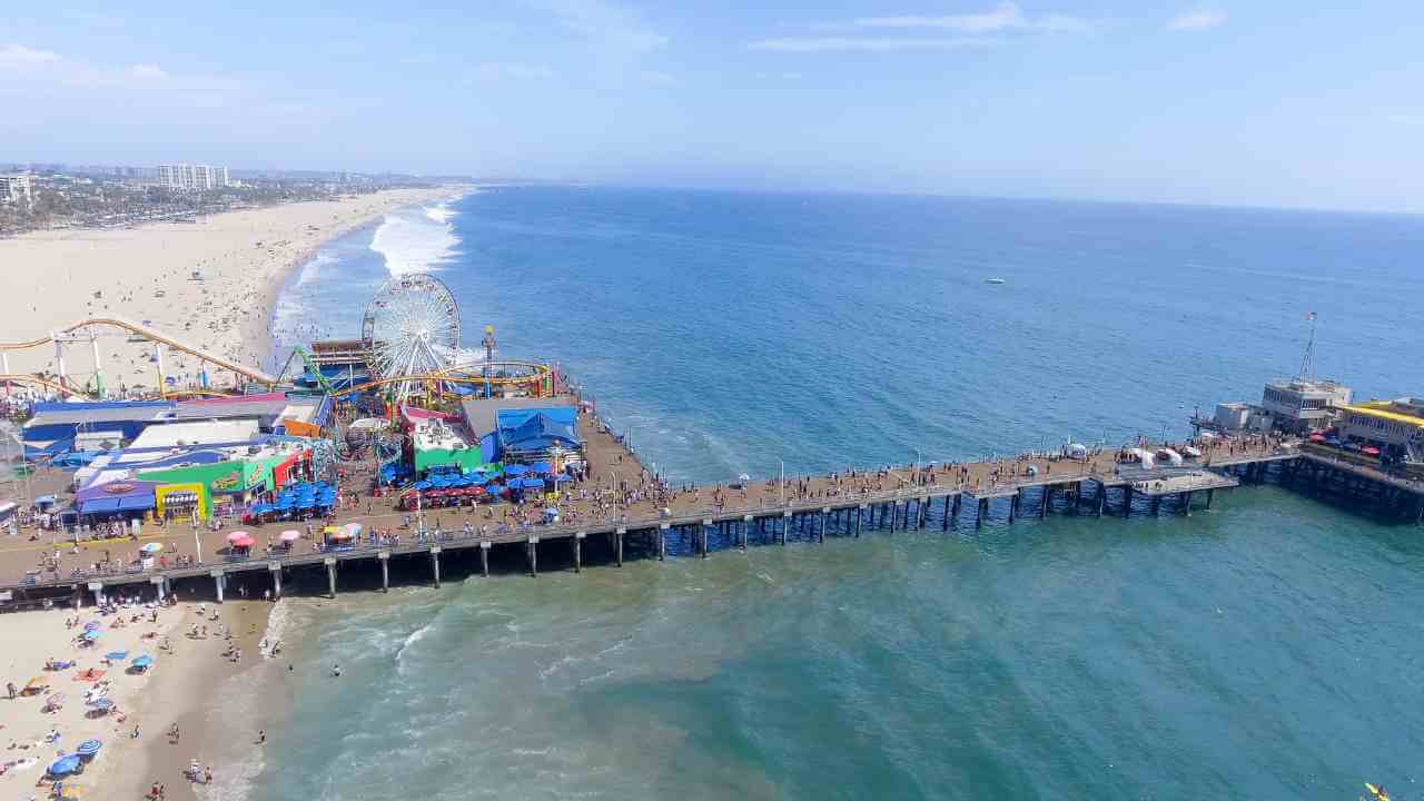 an aerial view of a pier and beach