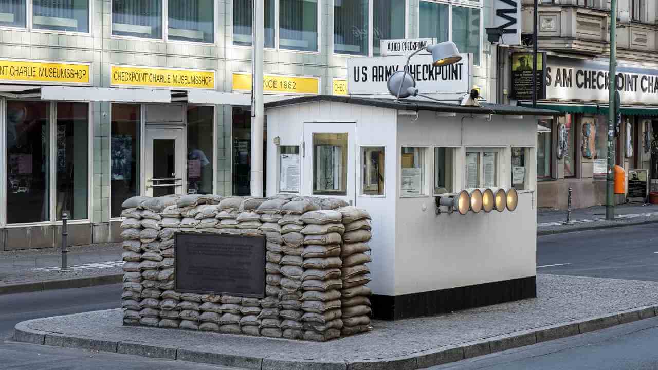 a small building with sandbags on the side of the street