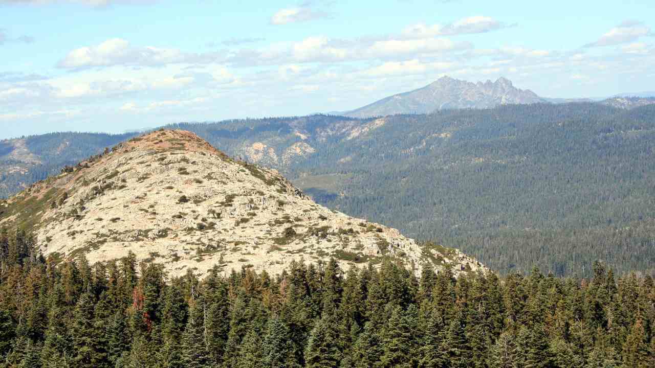 a view of the mountains from the top of a mountain