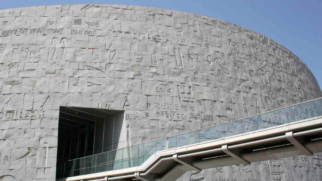 the building is made out of stone and has writing on it