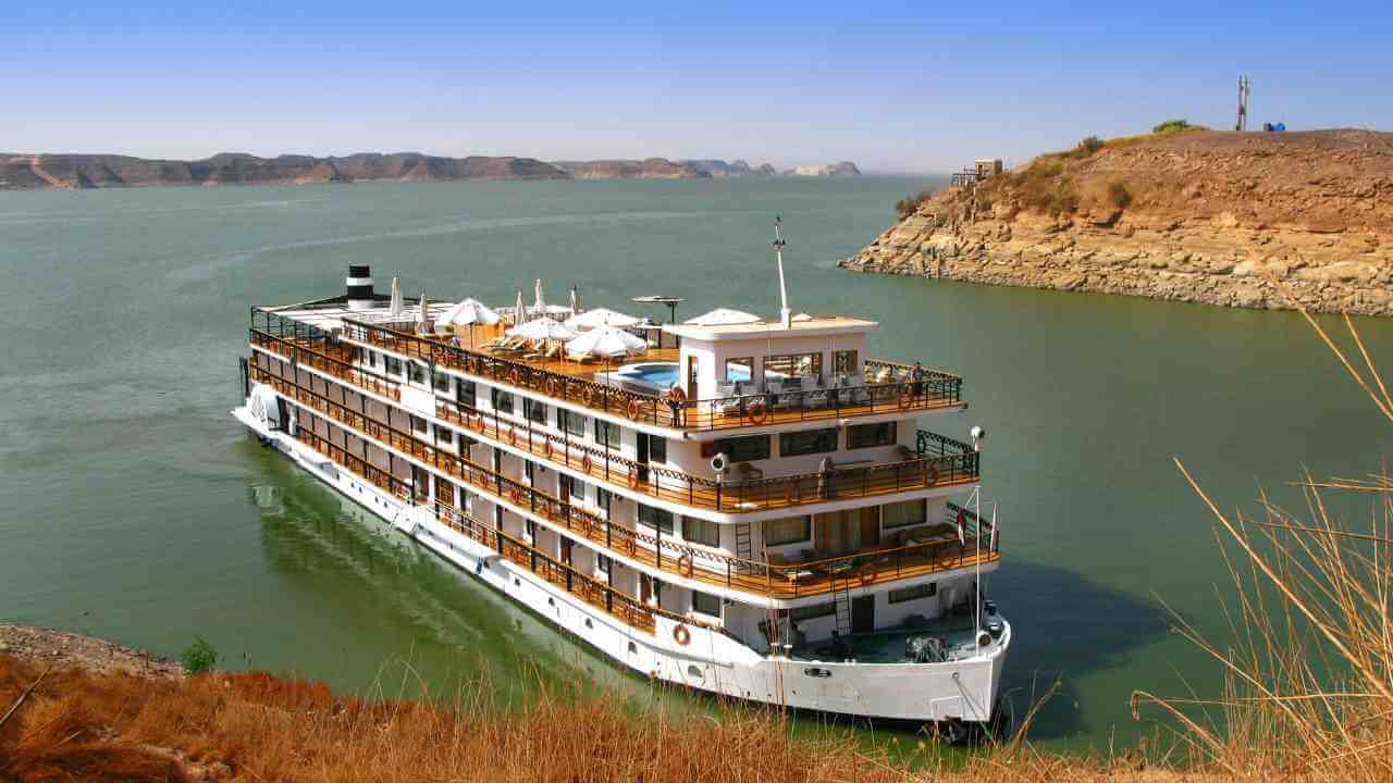 a large cruise ship floating in the middle of a body of water