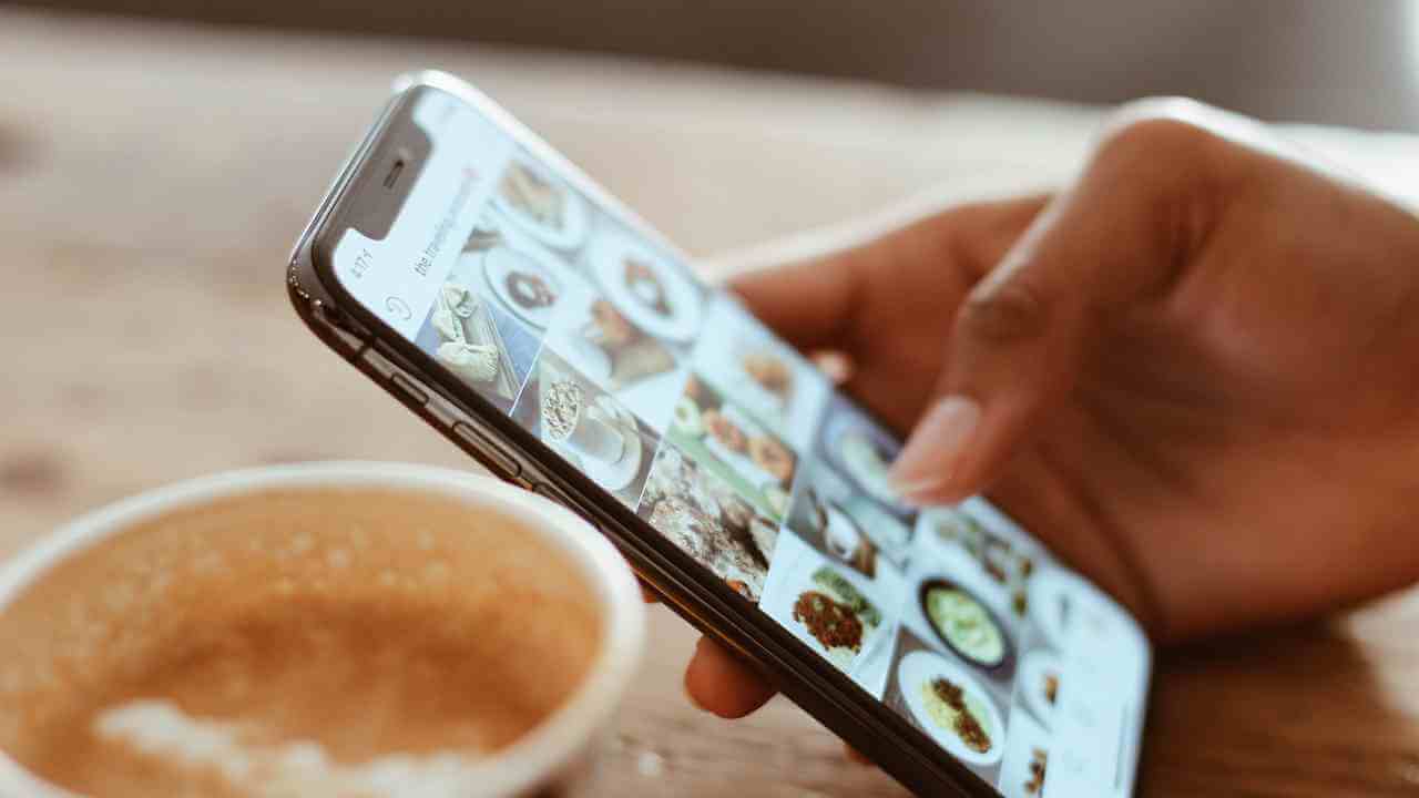 close-up of a person's hand using a smartphone to take a photo of food on a table - food stock videos & royalty-free footage