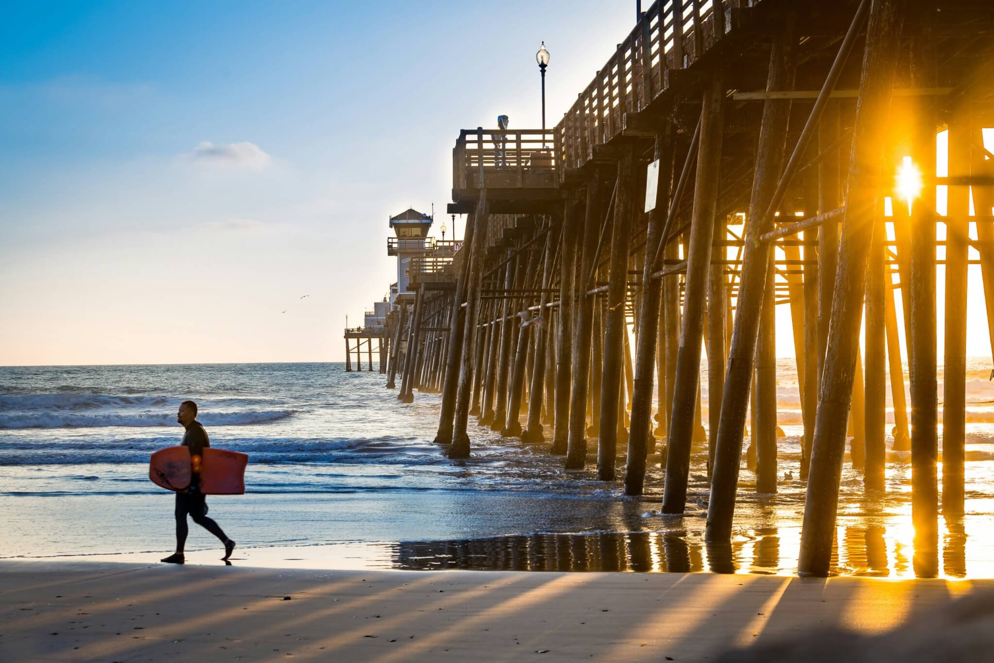 man holding a surf board