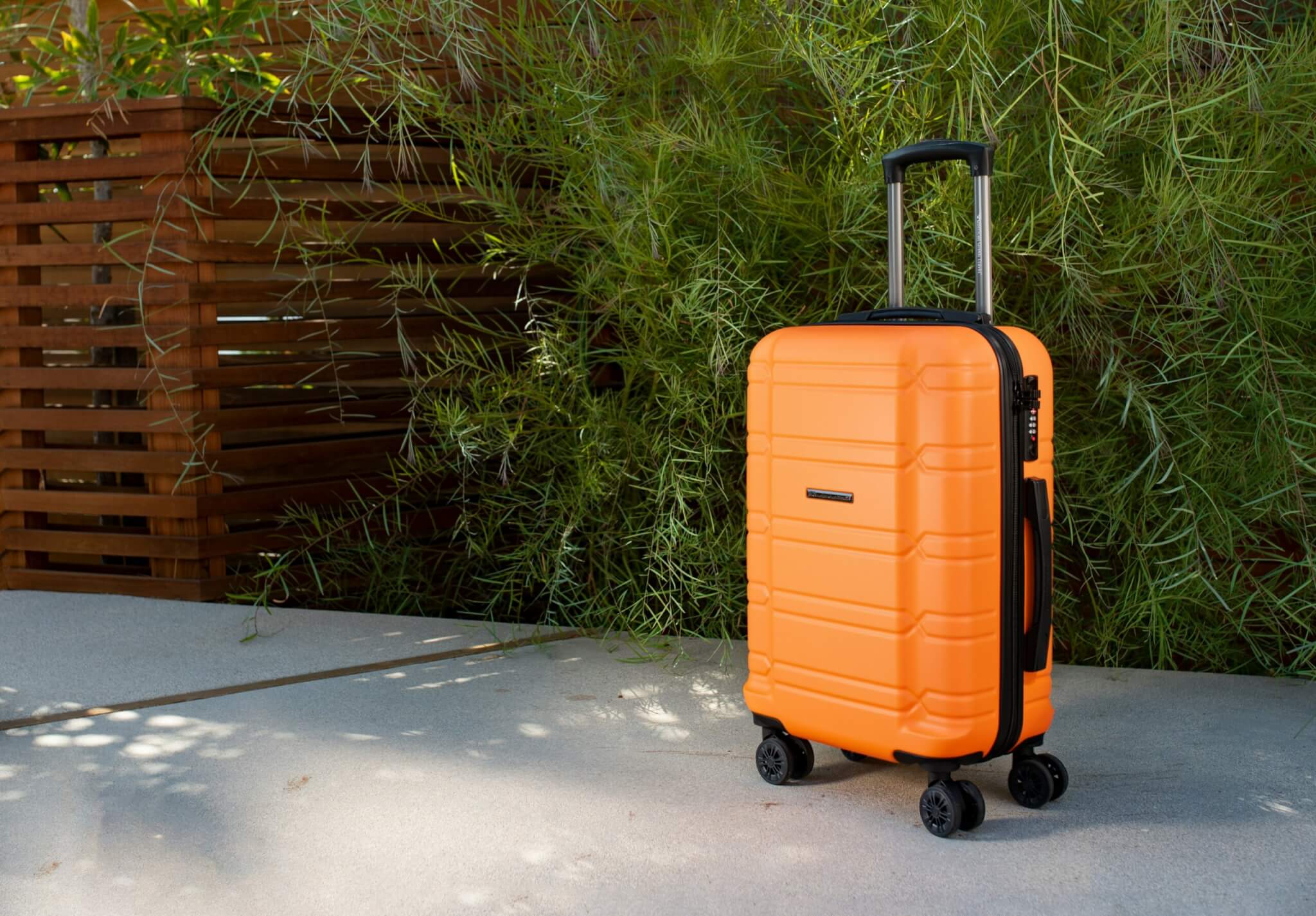 orange rolling suitcase