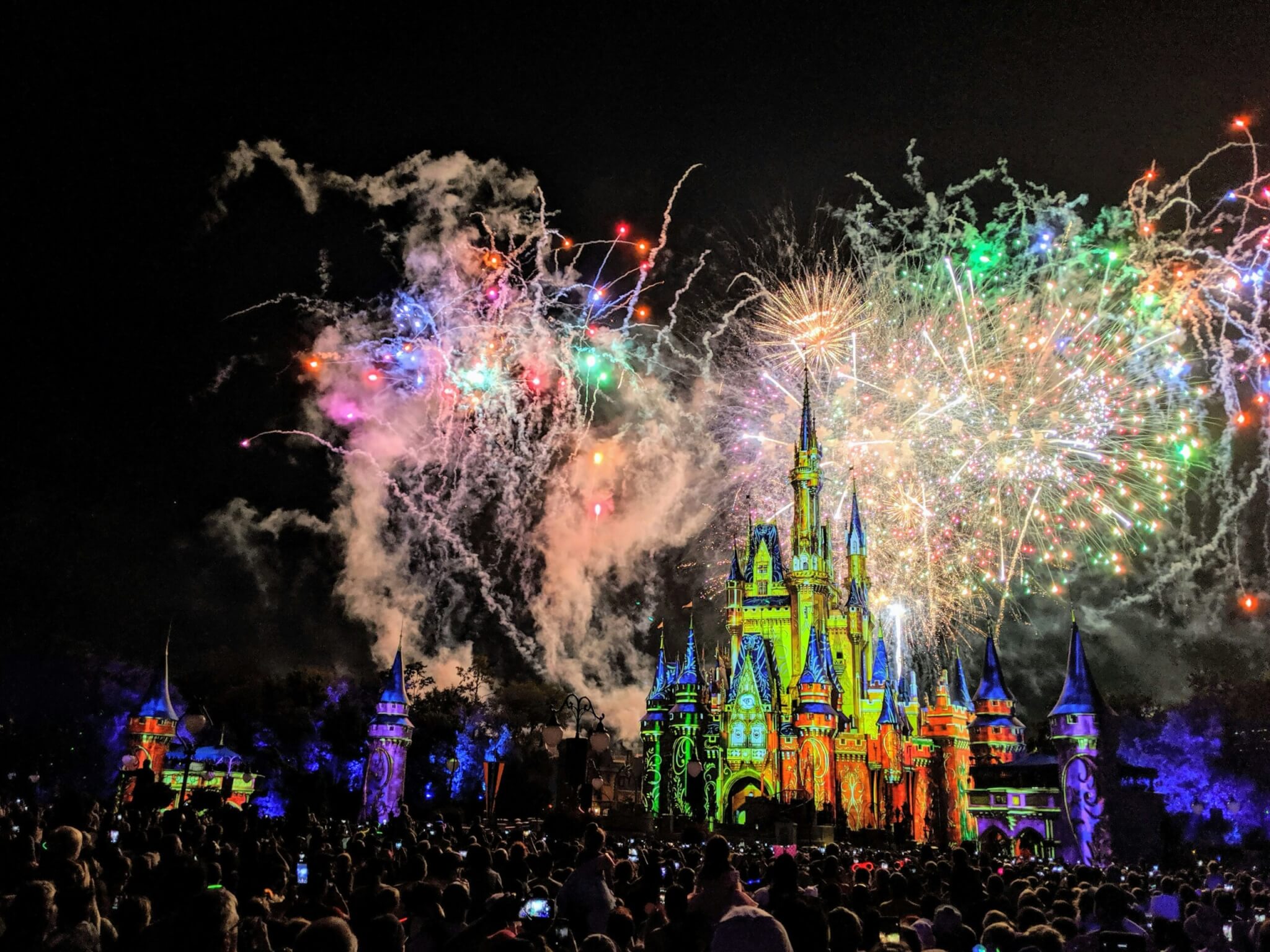 walt disney world castle with fireworks behind