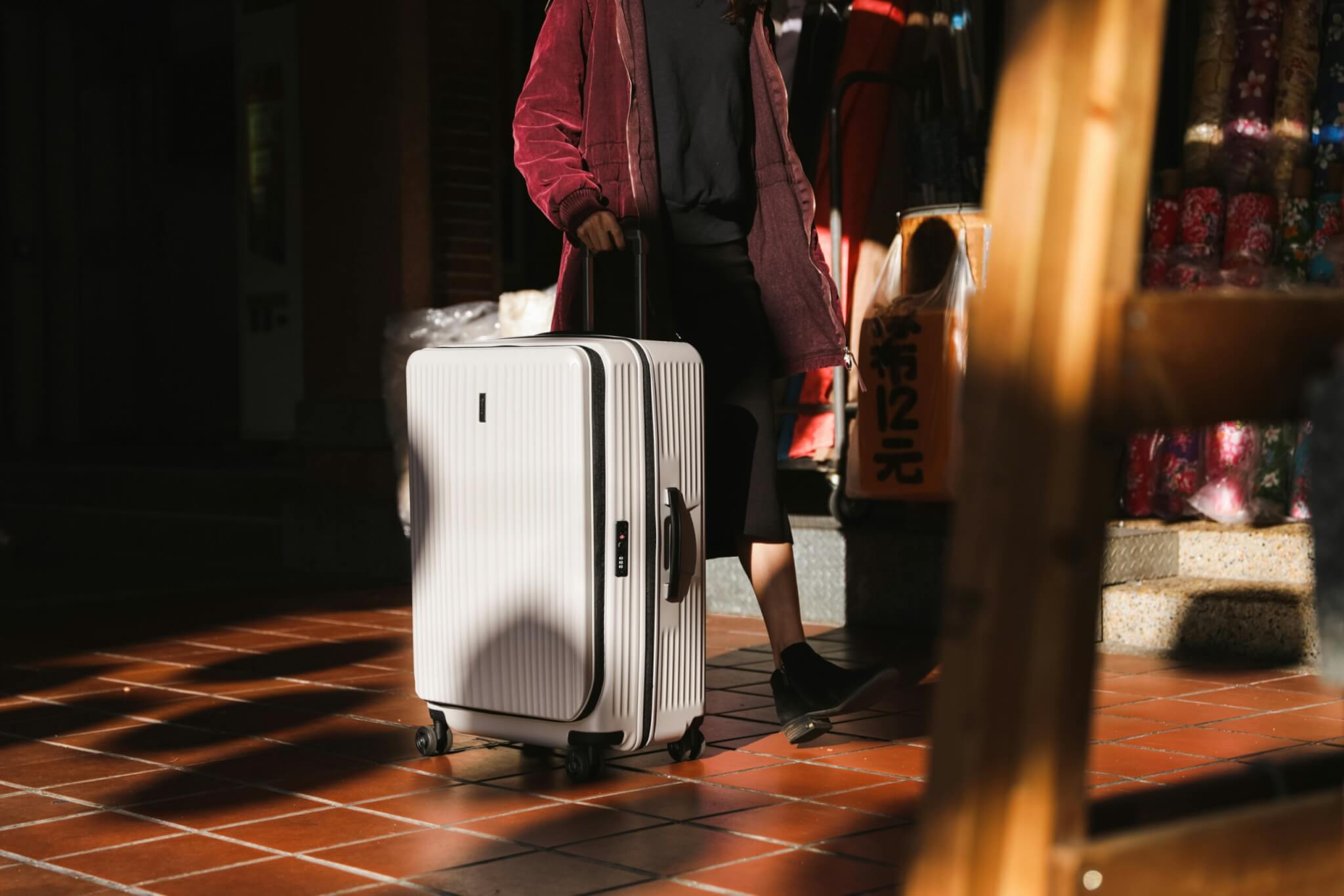 woman with rolling suitcase