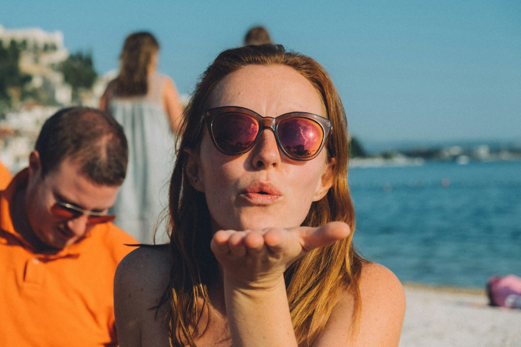 woman blowing a kiss