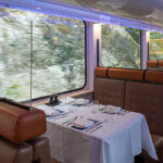 Interior of the gold leaf Rocky Mountaineer dining car train wagon while riding in British Columbia, Canada.