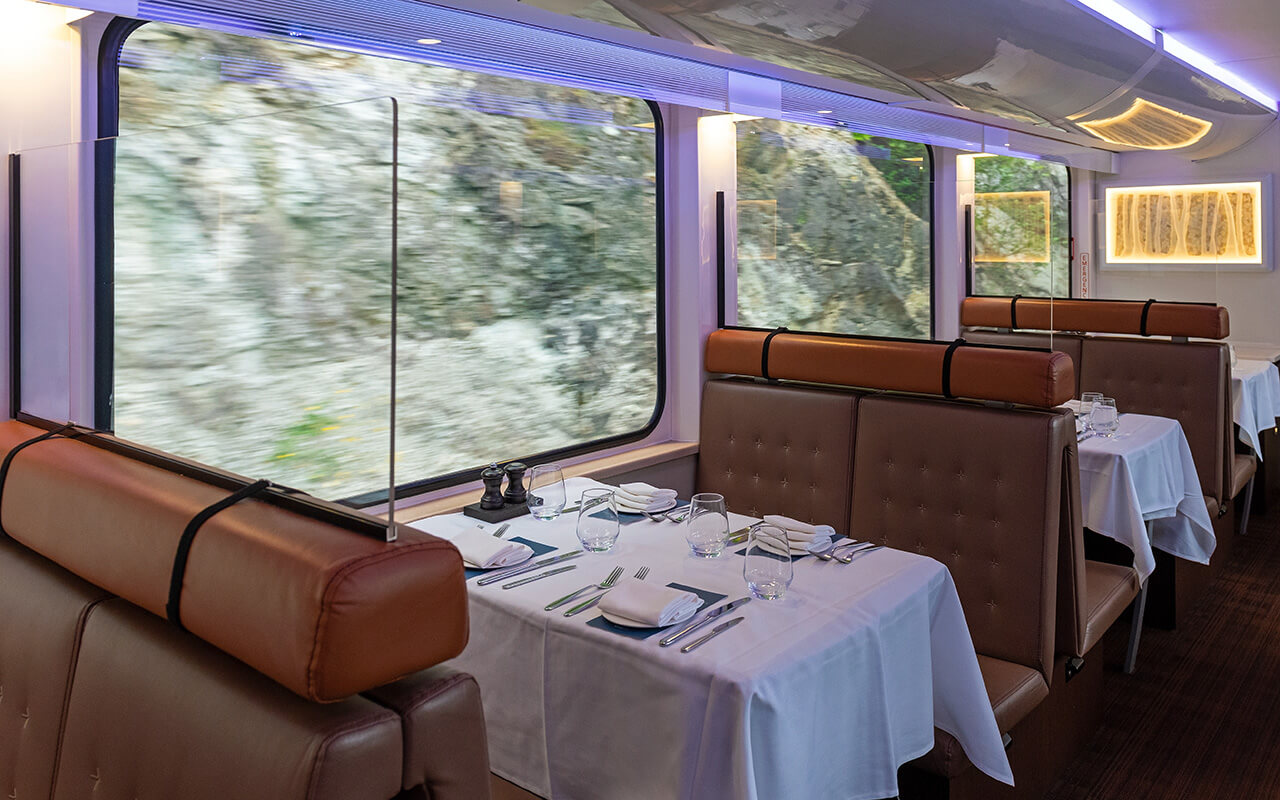 Interior of the gold leaf Rocky Mountaineer dining car train wagon while riding in British Columbia, Canada.