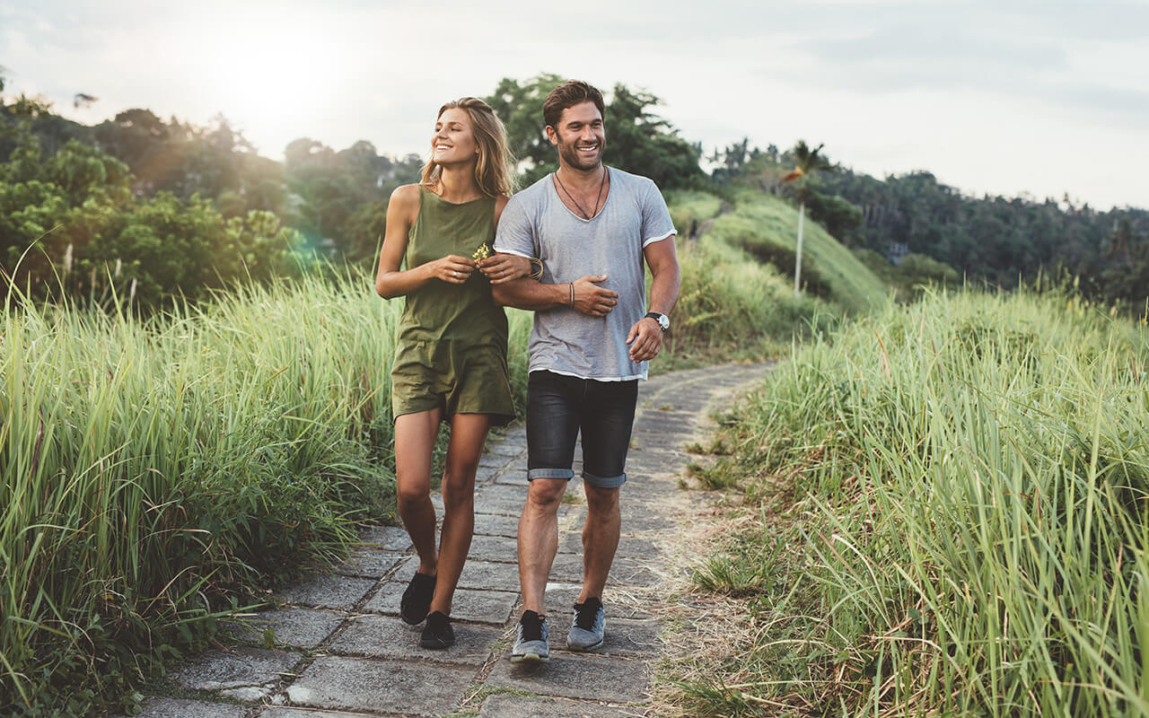 Couple walking on a trail 