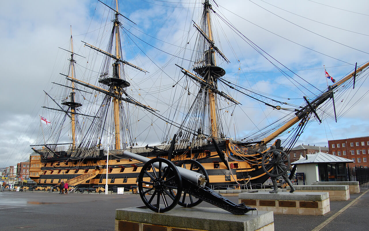 Exterior view of the HMS Victory in harbor in Portsmouth