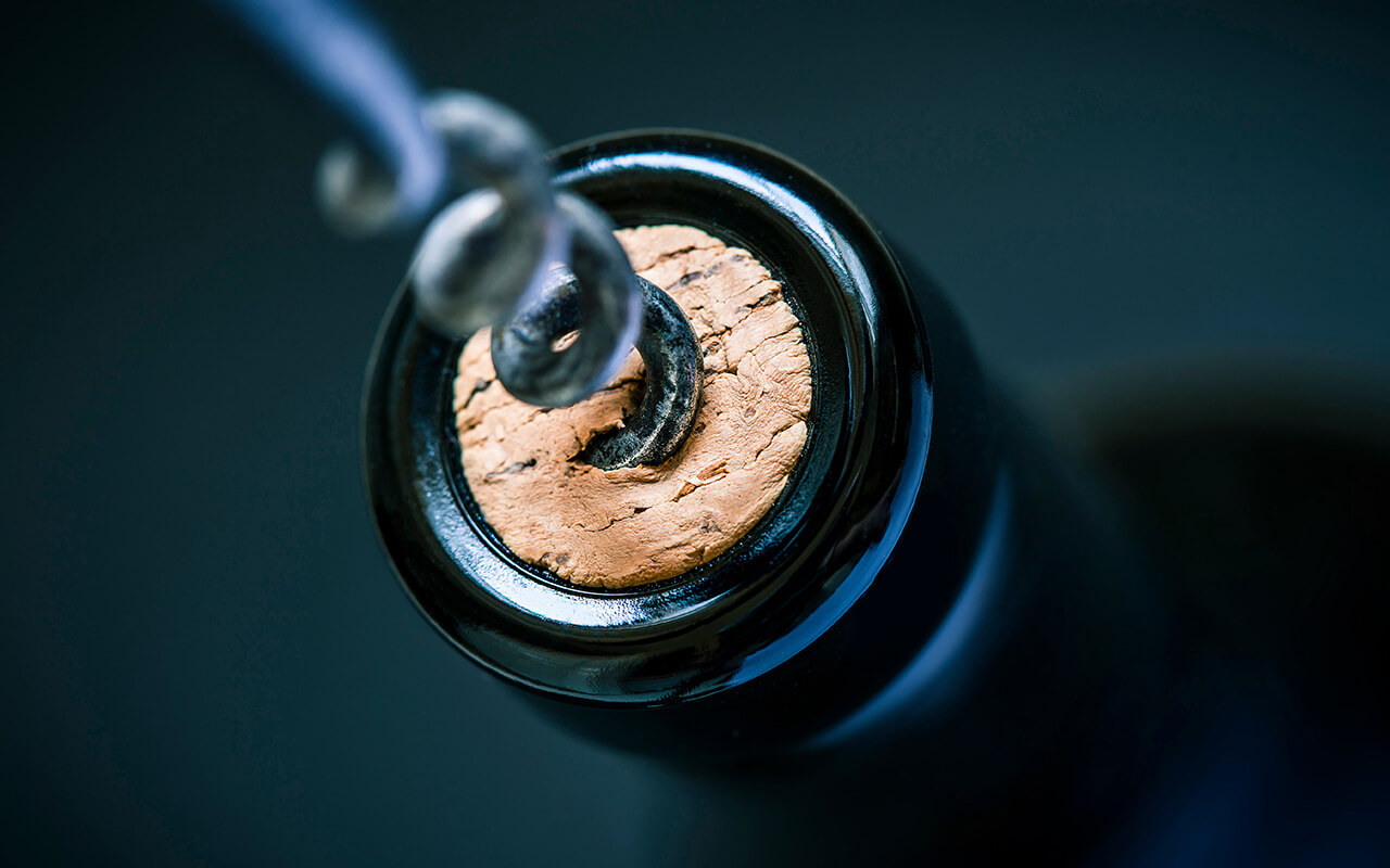 Cork being removed from a wine bottle