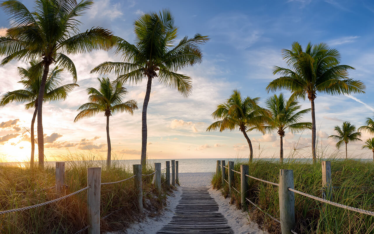 Panorama view of footbridge to the Smathers beach at sunrise - Key West, Florida.