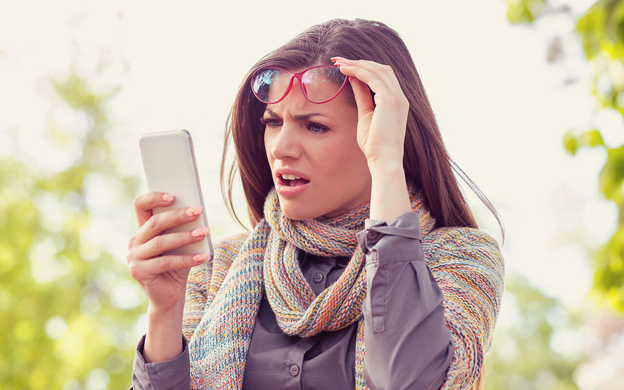 Woman looking confused at her phone