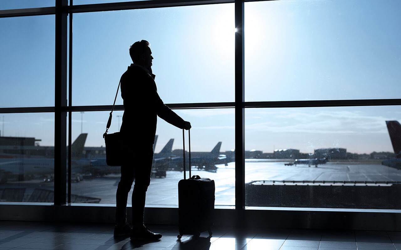 Man on the phone at an airport