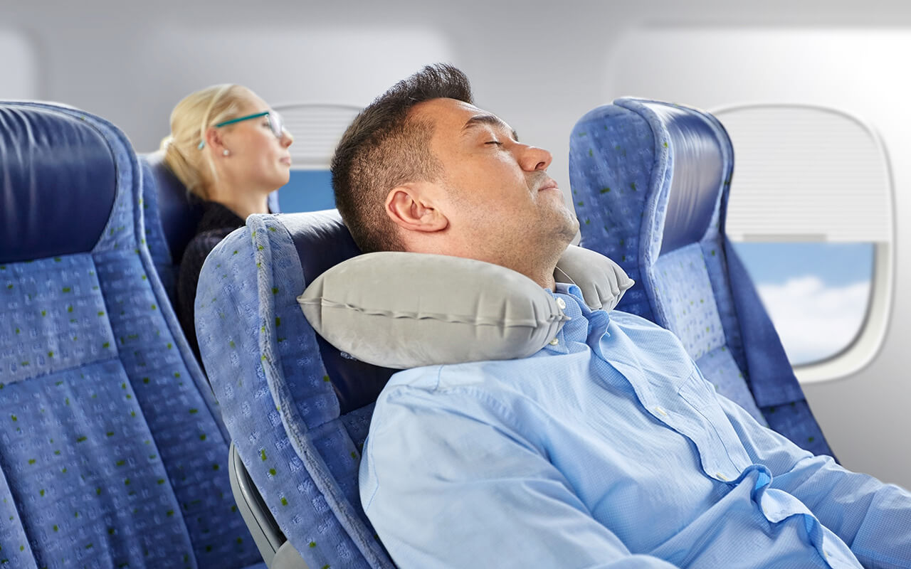 Man sleeping on an airplane