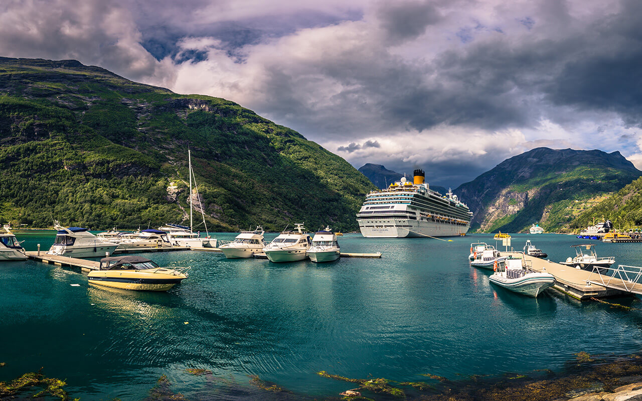 Geiranger - July 30, 2018: Cruise boat in the UNESCO town of Geiranger, Norway