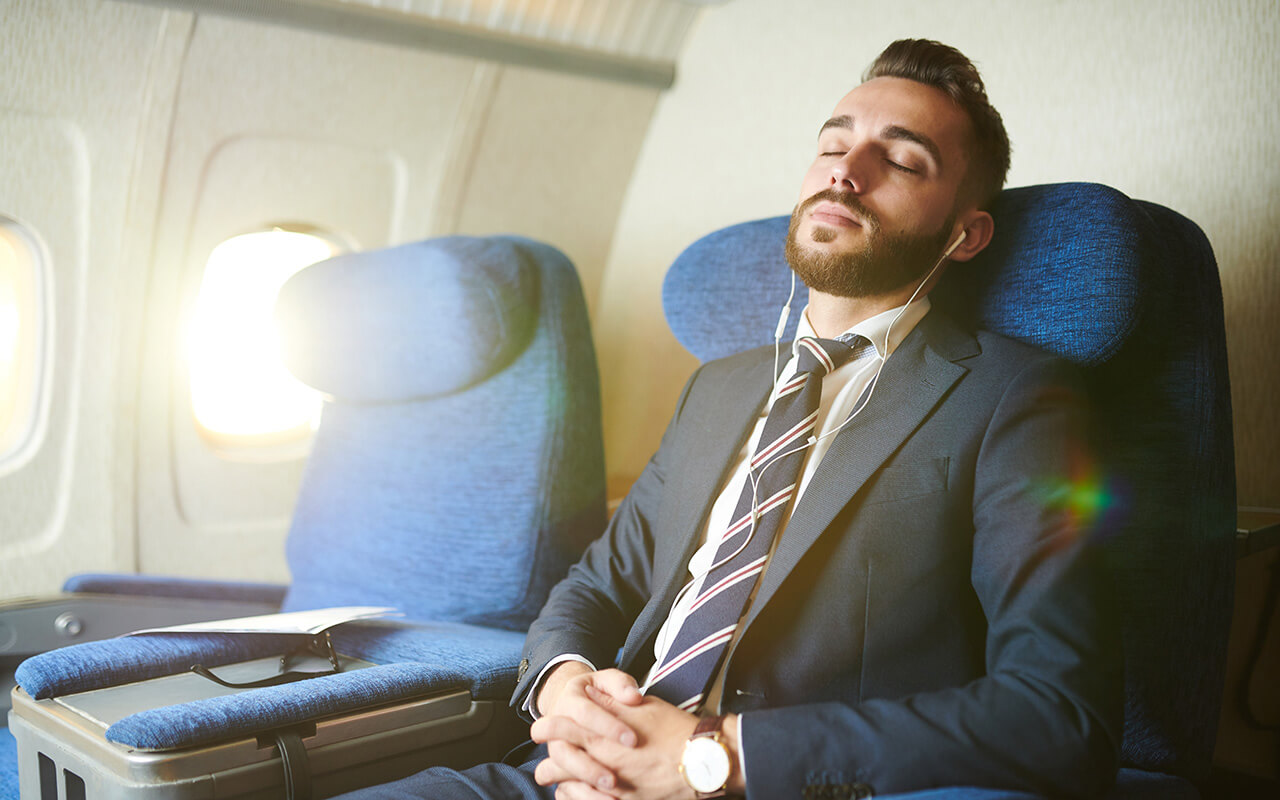 Man sleeping on a plane