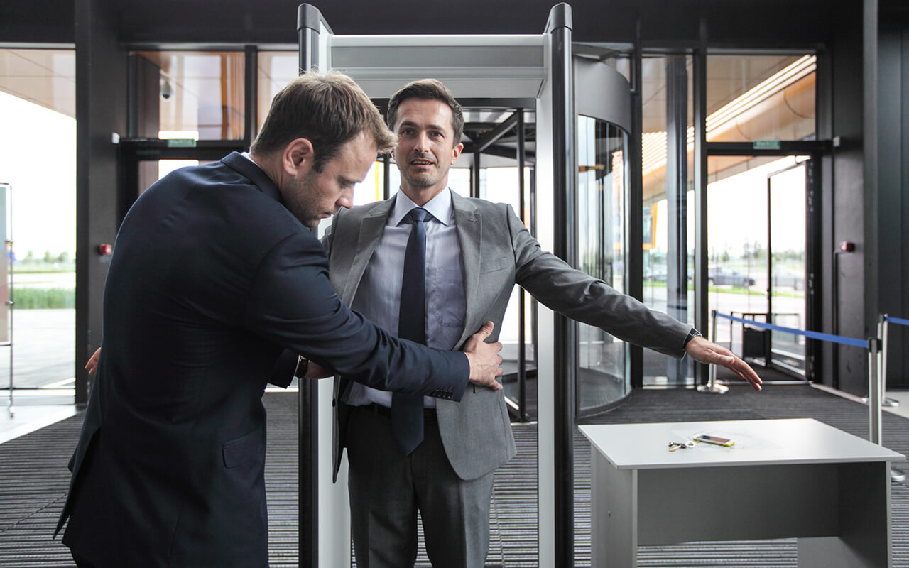 Man walking through metal detector