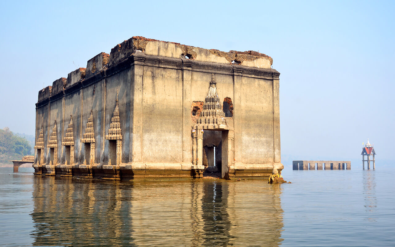 Sunken temple and bell tower in Thailand