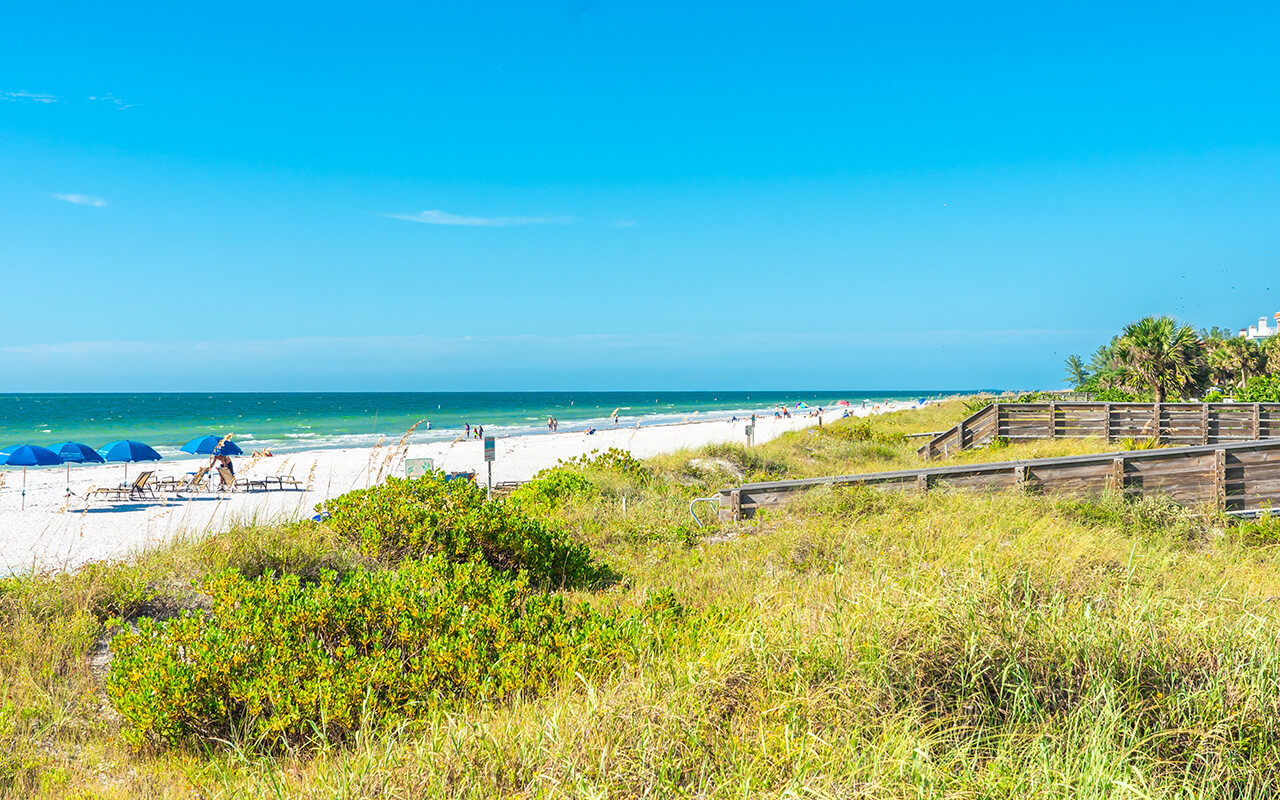 Indian rocks beach with green grass in Florida, USA