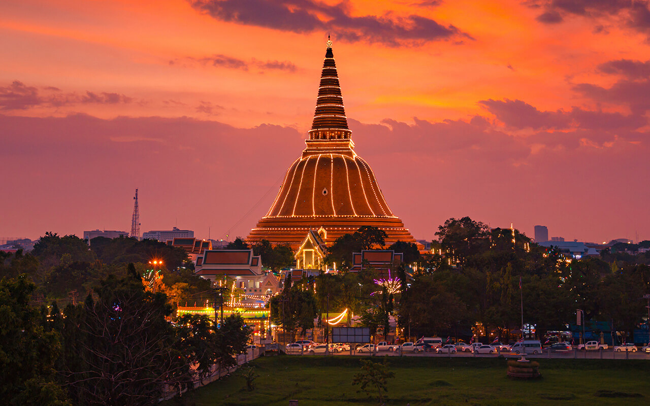 Large golden pagoda Located in the community at sunset , Phra Pathom Chedi , Nakhon Pathom province, Thailand.