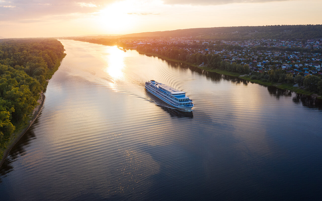 Panorama of the cruise ship moving on the river 