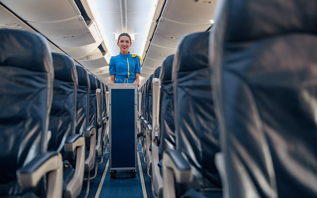 Airplane food cart coming down the aisle