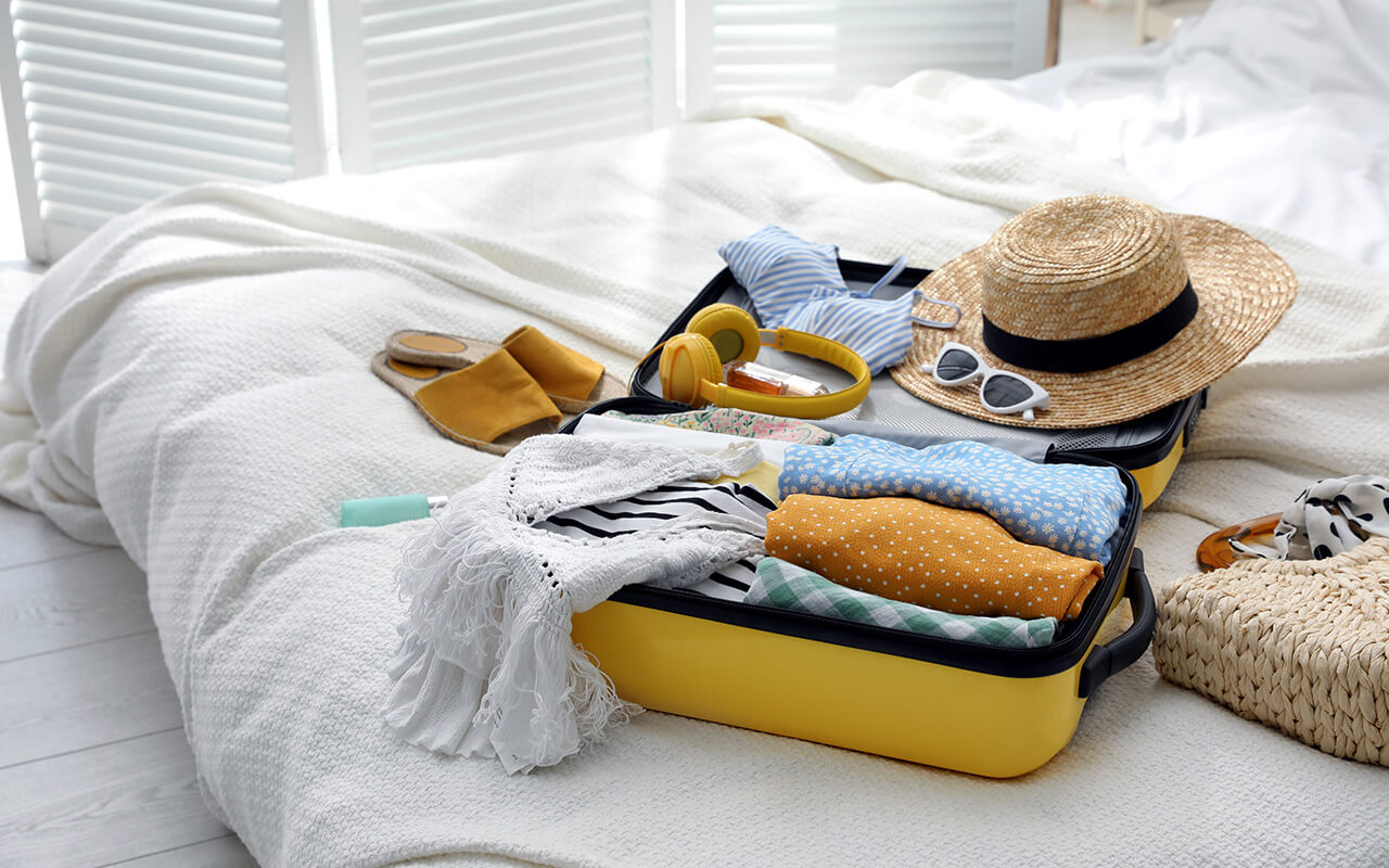 Open suitcase on a bed