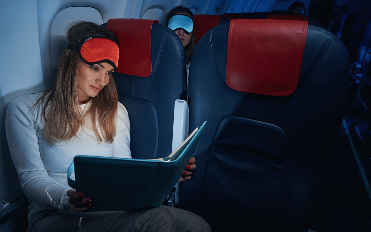 Woman reading on a plane